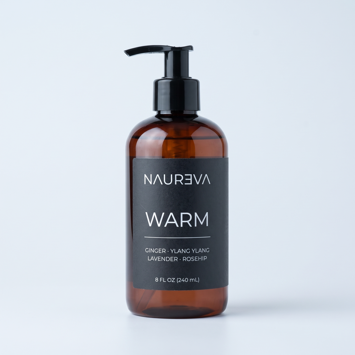 Naureva Warm ylang ylang and ginger massage oil, 8 fl oz amber pump bottle